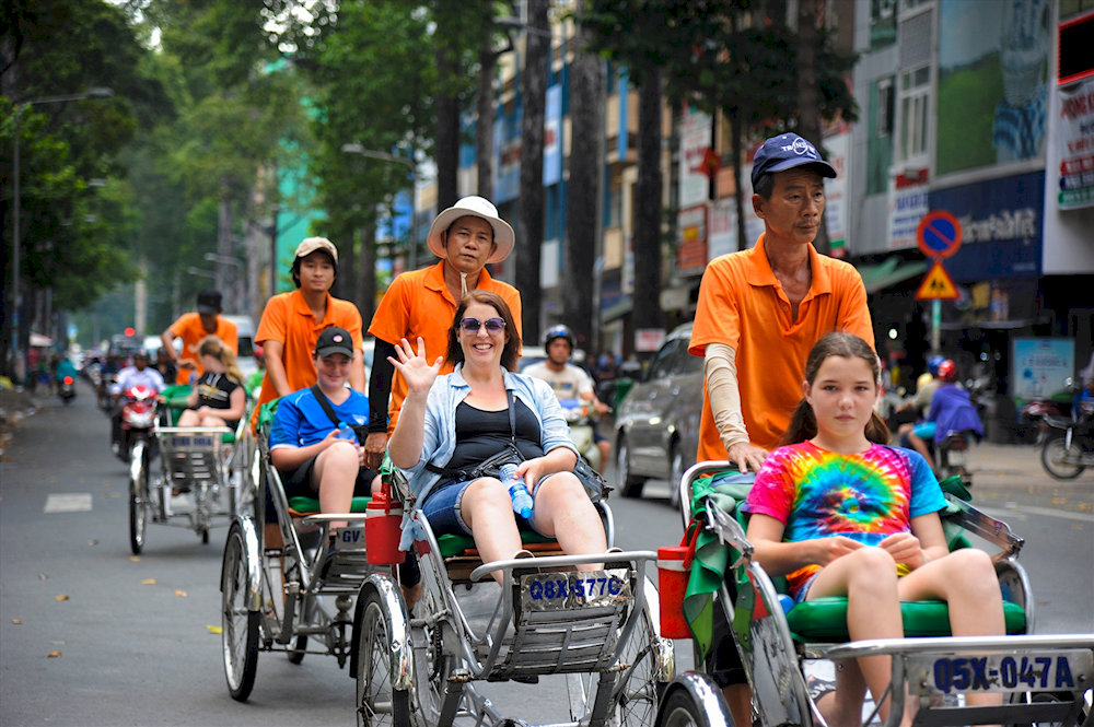 Wearing an Ao Dai and cycling around Ho Chi Minh City by cyclo is the perfect way to truly experience the vibrant energy of Vietnam’s largest city